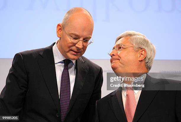 Martin Blessing, left, chief executive officer of Commerzbank AG, left, speaks to Klaus-Peter Mueller, chairman of the bank's supervisory board, at...