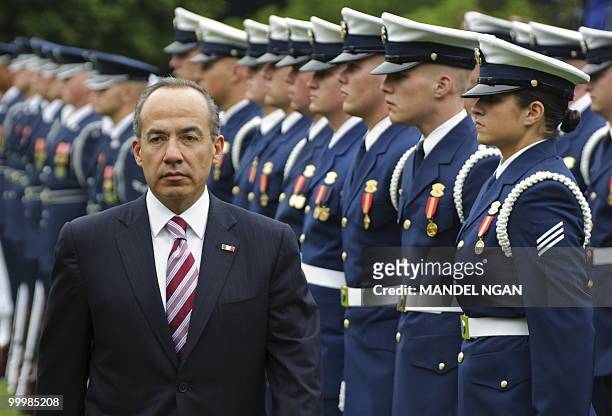 Mexico�s President Felipe Calderón inspects an honour guard May 19, 2010 during a welcome ceremony on the South Lawn of the White House to celebrate...