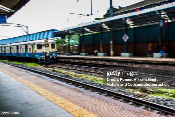 arrival of a local train at the platform - indian arrival stock pictures, royalty-free photos & images