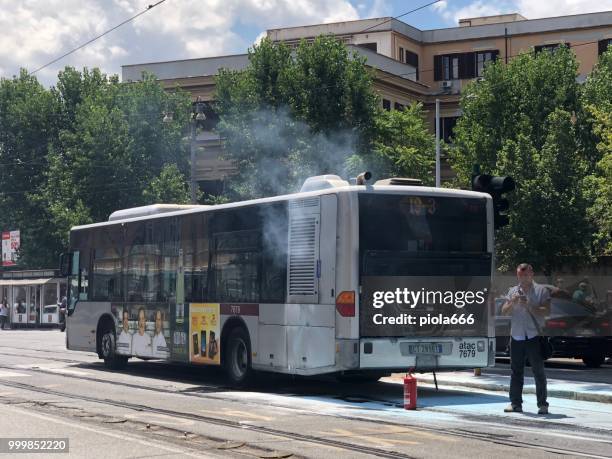 atac bus on fire in the center of rome - bus fire stock pictures, royalty-free photos & images