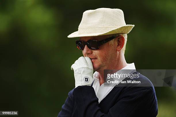 Presenter Chris Evans reacts to a shot during the Pro-Am round prior to the BMW PGA Championship on the West Course at Wentworth on May 19, 2010 in...