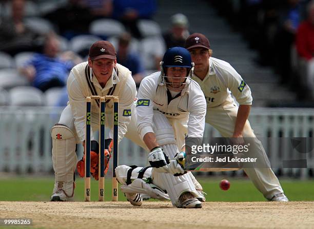 Dawid Malan of Middlesex watches the ball ahead of Gary Wilson and Rory Hamilton-Brown during the LV County Championship Division Two match between...