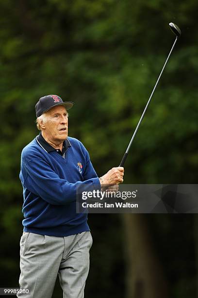 Entertainer Bruce Forsyth plays a shot during the Pro-Am round prior to the BMW PGA Championship on the West Course at Wentworth on May 19, 2010 in...