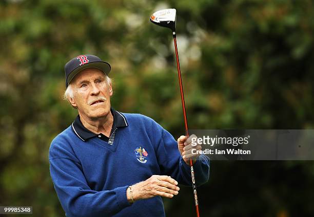 Entertainer Bruce Forsyth plays a shot during the Pro-Am round prior to the BMW PGA Championship on the West Course at Wentworth on May 19, 2010 in...