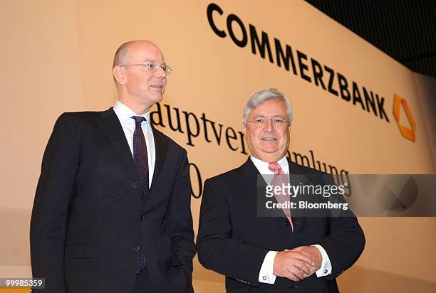 Martin Blessing, left, chief executive officer of Commerzbank AG, left, and Klaus-Peter Mueller, chairman of the bank's supervisory board, arrive for...