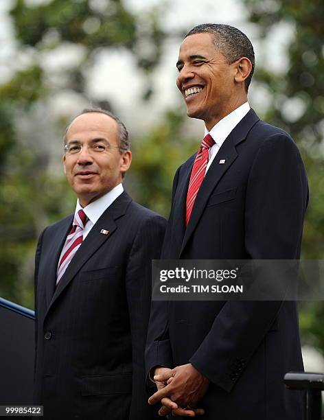 President Barack Obama stands with Mexican Presidernt Felipe Calderón during the State Arrival ceremony on the South Lawn of the White House on May...