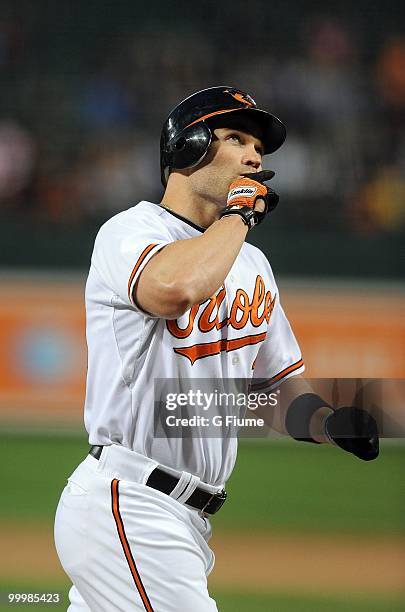 Luke Scott of the Baltimore Orioles celebrates after hitting a home run against the Kansas City Royals at Camden Yards on May 18, 2010 in Baltimore,...