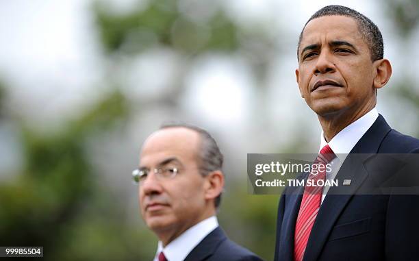 President Barack Obama stands with Mexican Presidernt Felipe Calderón during the State Arrival ceremony on the South Lawn of the White House on May...