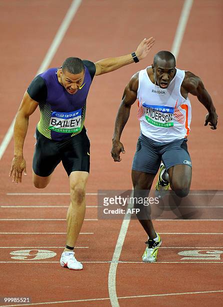 Ryan Bailey of the US crosses the finish line ahead of Jamaica's Marvin Anderson in the men's 200 meter event of the Daegu Pre-Championships Meeting...