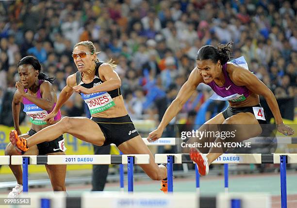 Lolo Jones of the US reces to the finish line with Virginia Powell and Kellie Wells in the women's 100 meter hurdle event of the Daegu...