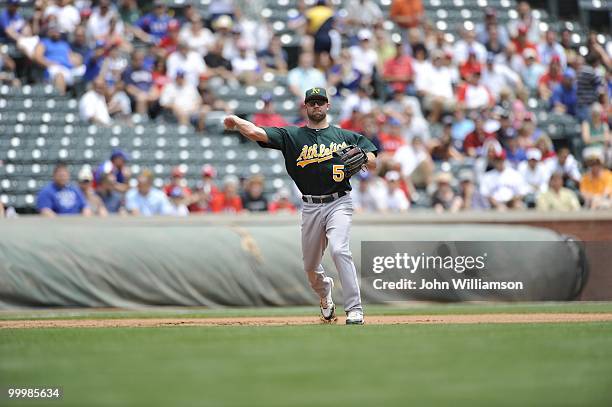 Third baseman Kevin Kouzmanoff of the Oakland Athletics fields his position as he throws to first base after catching a ground ball during the game...