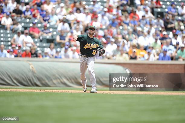 Third baseman Kevin Kouzmanoff of the Oakland Athletics fields his position as he throws to first base after catching a ground ball during the game...