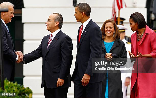 Vice President Joe Biden greets Mexican President Felipe Calderon during a welcoming ceremony with U.S. President Barack Obama, Mexican first lady...