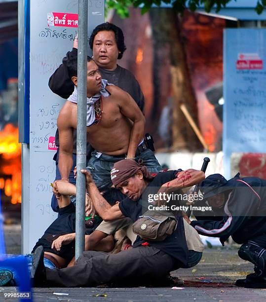 Thai anti-government red shirt protester falls after being shot by Thai military forces during fighting on May 19, 2010 in Bangkok, Thailand. At...
