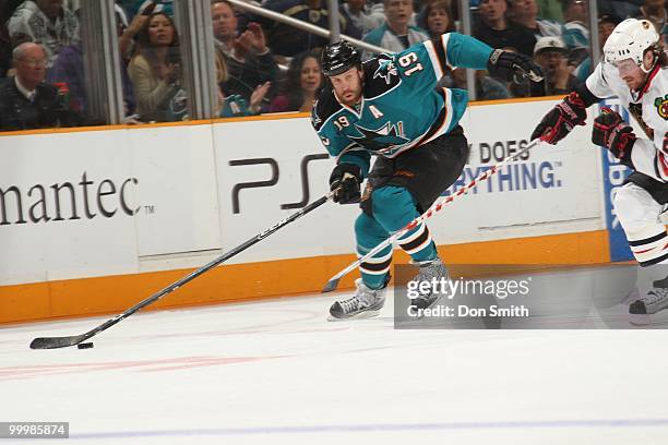 Joe Thornton of the San Jose Sharks moves the puck up ice in Game One of the Western Conference Finals during the 2010 NHL Stanley Cup Playoffs...