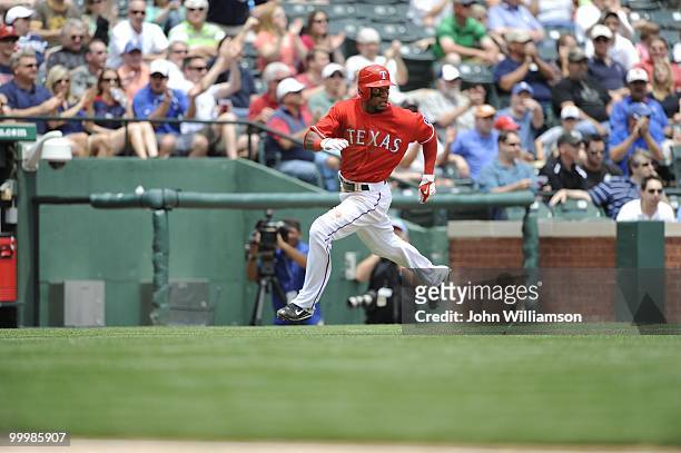 Julio Borbon of the Texas Rangers runs home to score a run during the game against the Oakland Athletics at Rangers Ballpark in Arlington in...