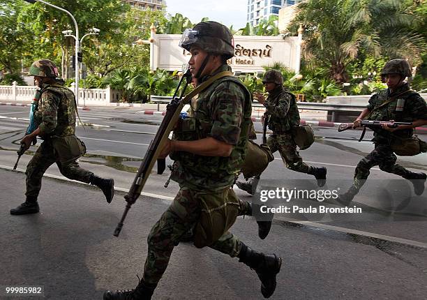 Thai soldiers start the early morning attack on the red shirt camp May 19, 2010 in Bangkok, Thailand. At least 5 people are reported to have died as...