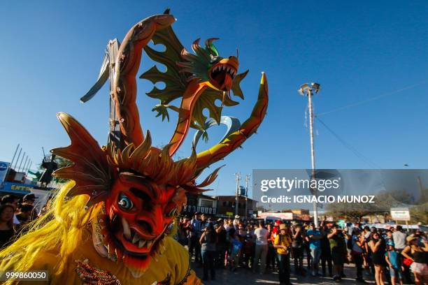 Costumed traditional dancers perform during the religious carnival of "La Tirana", in the streets of town La Tirana, 78 km east from Iquique in...