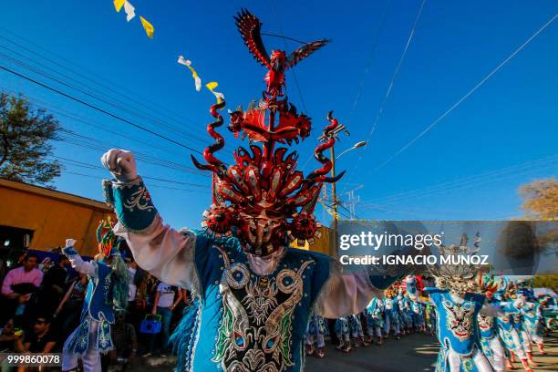 Costumed traditional dancers perform during the religious carnival of "La Tirana", in the streets of town La Tirana, 78 km east from Iquique in...