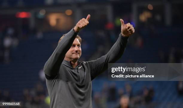 Leipzig's coach Ralph Hasenhuettel celebrates after the Bundesliga soccer match between Hamburg SV and RB Leipzig in the Volksparkstadium in Hamburg,...