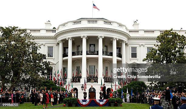 Mexican President Felipe Calderon addresses a welcoming ceremony with U.S. President Barack Obama during a state visit on the South Lawn of the White...