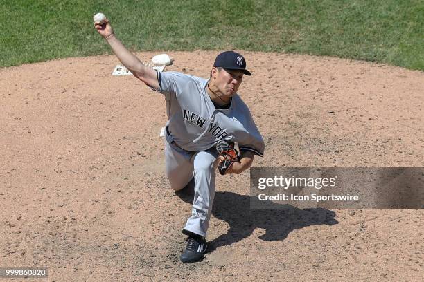 New York Yankees starting pitcher Masahiro Tanaka delivers a pitch to the plate during the seventh inning of the Major League Baseball game between...