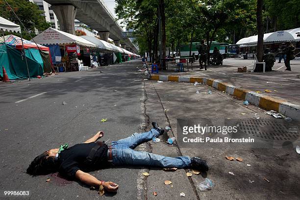 Redshirt protester lays dead shot by the military inside the red shirt camp May 19, 2010 in Bangkok, Thailand. The operation was to finally get the...