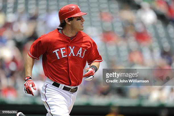 Ian Kinsler of the Texas Rangers runs to first base after hitting the ball during the game against the Oakland Athletics at Rangers Ballpark in...