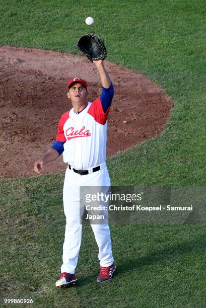 Yosvani Torres Gomez of Cuba plays with the ball in the second inning during the Haarlem Baseball Week game between Cuba and Japan at Pim Mulier...