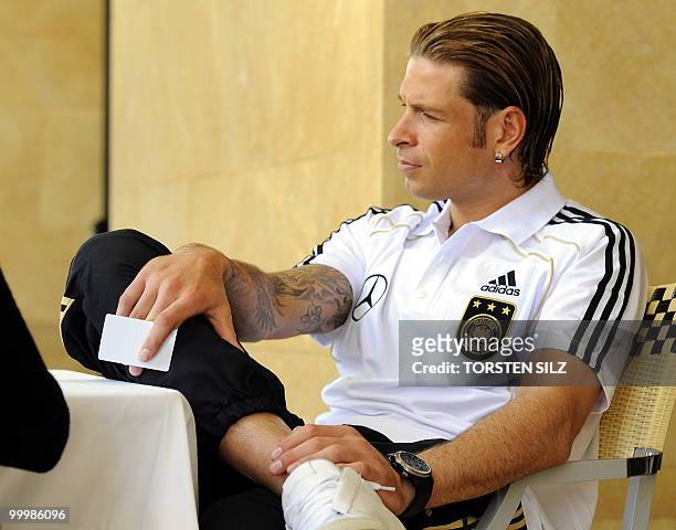Germany's goalkeeper Tim Wiese gives an interview during a so-called media day at the Verdura Golf and Spa resort, near Sciacca May 19, 2010. The...