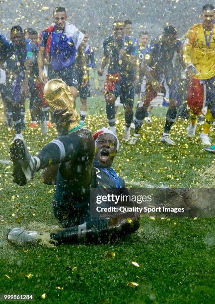 Benjamin Mendy of France celebrates the victory with the trophy after the 2018 FIFA World Cup Russia Final between France and Croatia at Luzhniki...