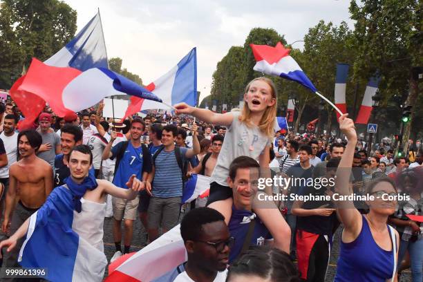 Fans celebrate the Victory of France in the World Cup 2018, on the Champs Elysees on July 15, 2018 in Paris, France.