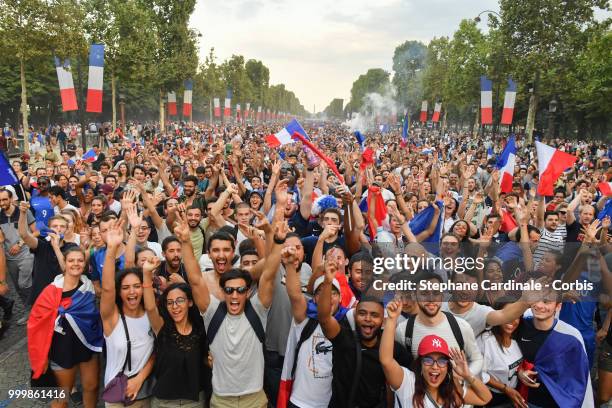 Fans celebrate the Victory of France in the World Cup 2018, on the Champs Elysees on July 15, 2018 in Paris, France.