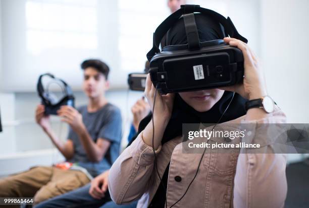 Students from a school in Hesse watch a movie about the G20 riots in Hamburg with virtual reality glasses during a seminar at the former Stasi prison...