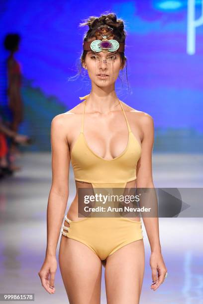 Model walks the runway for Pikai Swimwear at Miami Swim Week powered by Art Hearts Fashion Swim/Resort 2018/19 at Faena Forum on July 15, 2018 in...