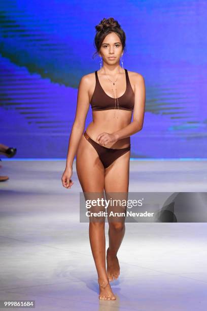 Model walks the runway for Pikai Swimwear at Miami Swim Week powered by Art Hearts Fashion Swim/Resort 2018/19 at Faena Forum on July 15, 2018 in...