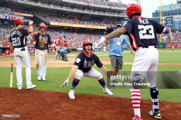 Peter Alonso of Team USA is greeted by Buddy Reed after hitting a two-run home run in the seventh inning during the SiriusXM All-Star Futures Game at...