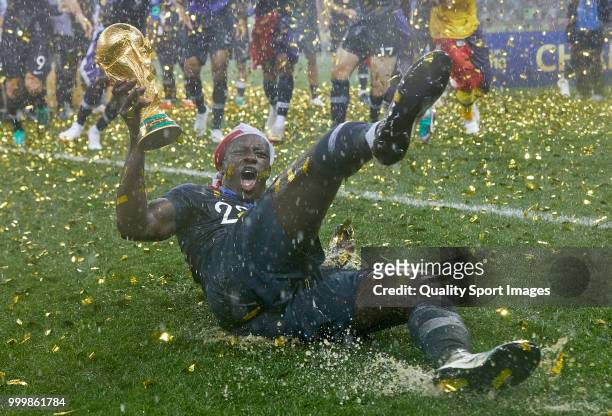Benjamin Mendy of France celebrates the victory with the trophy after the 2018 FIFA World Cup Russia Final between France and Croatia at Luzhniki...