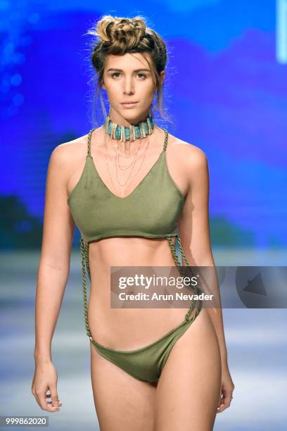 Model walks the runway for Pikai Swimwear at Miami Swim Week powered by Art Hearts Fashion Swim/Resort 2018/19 at Faena Forum on July 15, 2018 in...