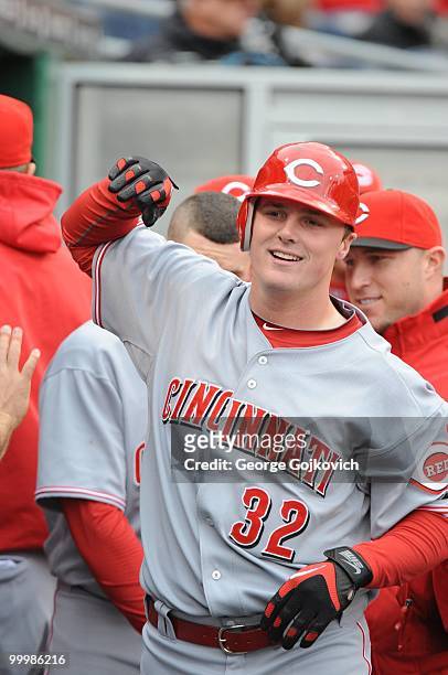Outfielder Jay Bruce of the Cincinnati Reds celebrates with teammates after hitting the first of his two home runs during a Major League Baseball...