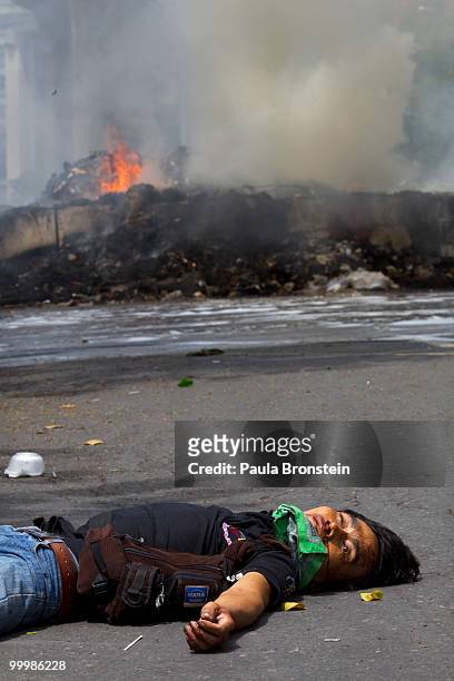 Red Shirt protester lays dead, shot by the military inside the red shirt camp May 19, 2010 in Bangkok, Thailand. The operation was to finally get the...