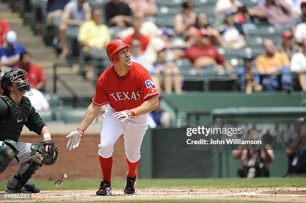 David Murphy of the Texas Rangers bats and runs to first base from the batter's box during the game against the Oakland Athletics at Rangers Ballpark...