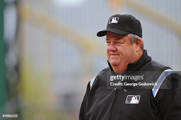 Major League Baseball umpire Joe West looks on from the field during a game between the Cincinnati Reds and Pittsburgh Pirates at PNC Park on April...