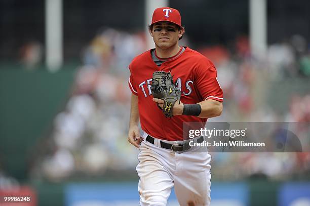 Second baseman Ian Kinsler of the Texas Rangers runs off the field to the dugout after the third out of the inning during the game against the...