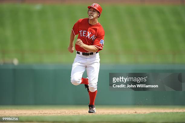 David Murphy of the Texas Rangers runs the bases as he advances to third base during the game against the Oakland Athletics at Rangers Ballpark in...