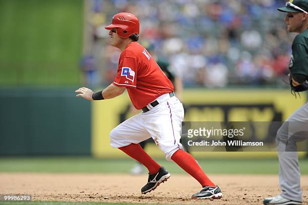 Ian Kinsler of the Texas Rangers runs from first base on the pitch as he attempts to steal second base during the game against the Oakland Athletics...