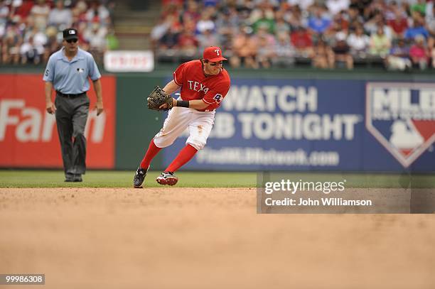 Second baseman Ian Kinsler of the Texas Rangers fields his position as he catches a ground ball during the game against the Oakland Athletics at...