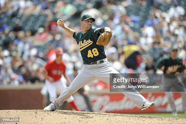 Michael Wuertz of the Oakland Athletics pitches during the game against the Texas Rangers at Rangers Ballpark in Arlington in Arlington, Texas on...