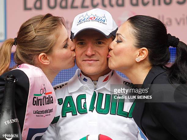 Russia's Evgeny Petrov celebrates on the podium after winning the 11st stage of the 93rd Giro d'Italia going from Lucera to L'Aquila in victory on...