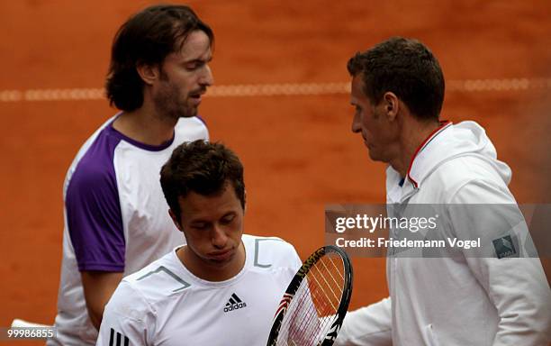Philip Kohlschreiber , Christopher Kas and national coach Patrick Kuehnen of Germany looks on during the double match against Juan Monaco and Horacio...